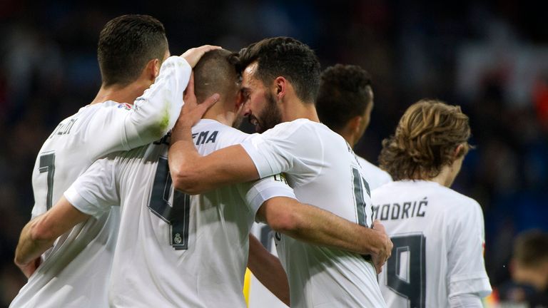 Karim Benzema celebrates with team-mates after scoring
