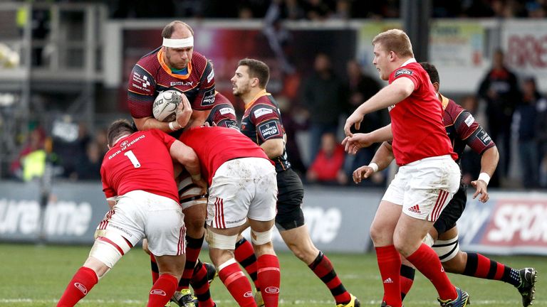 Rynard Landman is tackled by the Munster defence
