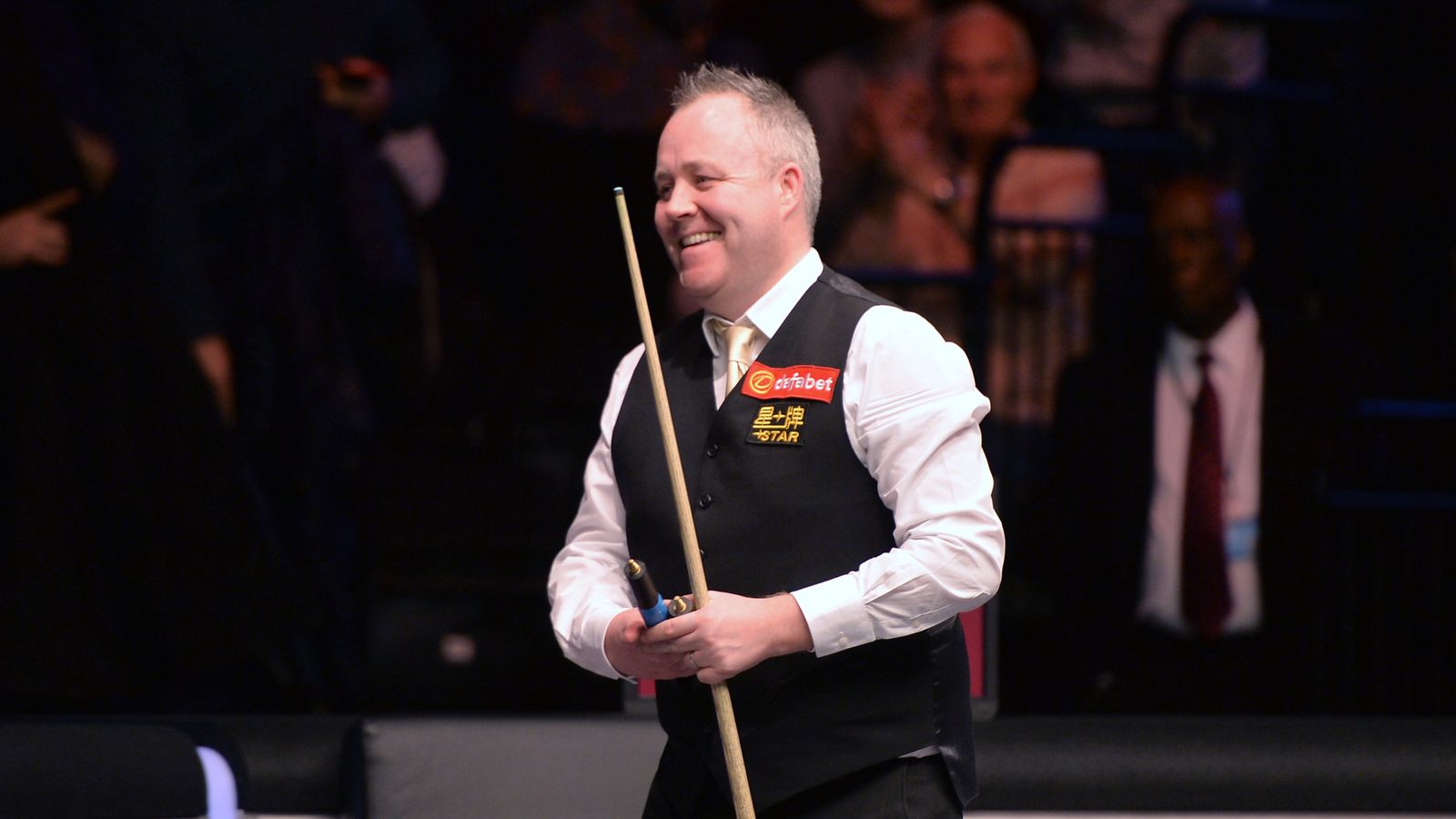 John Higgins has reached the quarter-finals of the Masters after a tense 6-...