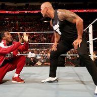 The Rock prepares to pummel Xavier Woods