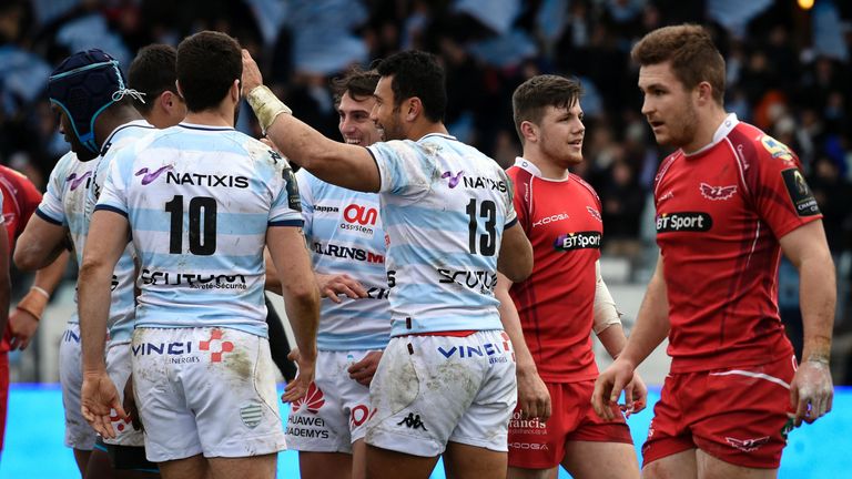 Racing Metro 92 centre Casey Laulala is congratulated by team-mates after scoring one of his three tries