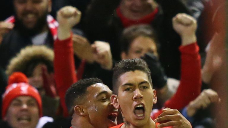 Roberto Firmino (right) celebrates scoring Liverpool's first goal against Arsenal with his team-mate Jordon Ibe