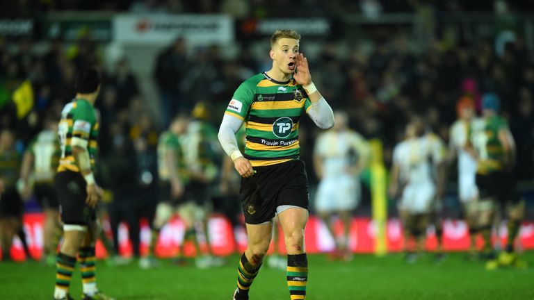Harry Mallinder of Northampton Saints relays a call to his team mates
