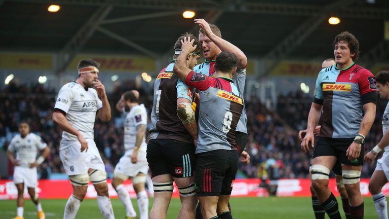 Jack Clifford is congratulted by Harlequins team-mates after scoring his team's second try