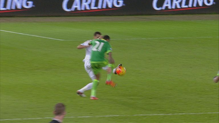 Kyle Naughton wins the ball form Yann M'Vila but is sent off