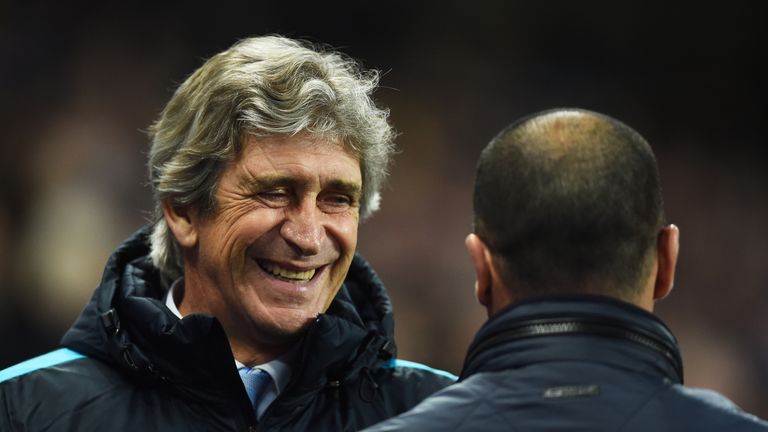 Manchester City boss Manuel Pellegrini greets Roberto Martinez