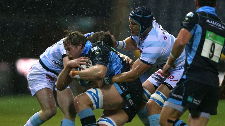 Jonny Gray is tackled by Racing duo Bernard Le Roux (right) and Louis Dupichot