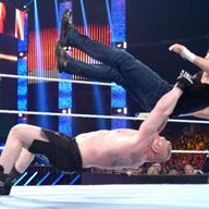Brock Lesnar dishes out a German Suplex to Dean Ambrose