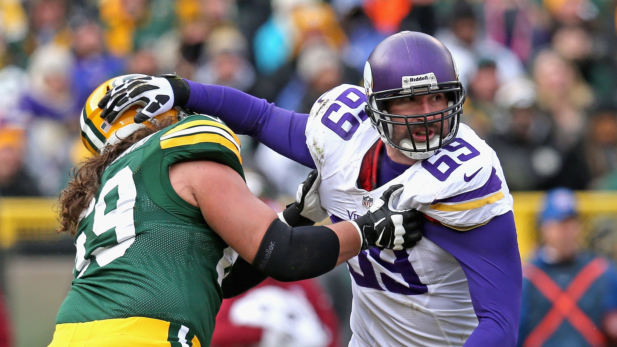 Former Vikings player Jared Allen rides horse onto field