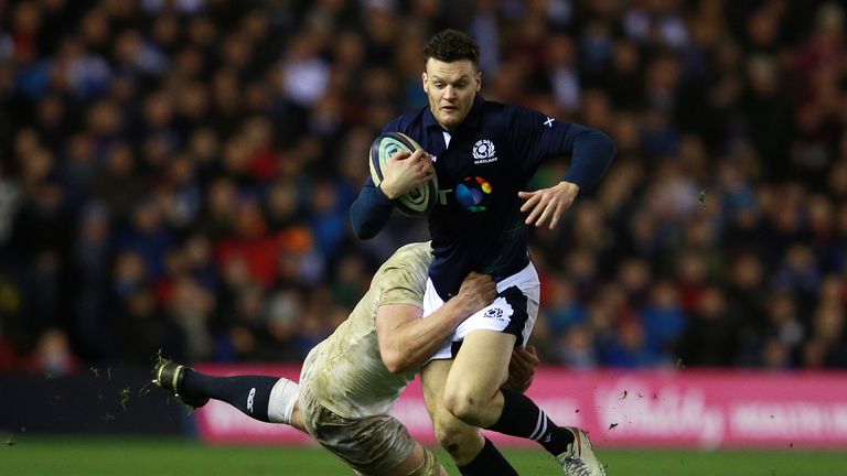 Scotland's Duncan Taylor is tackled by England's George Kruis 