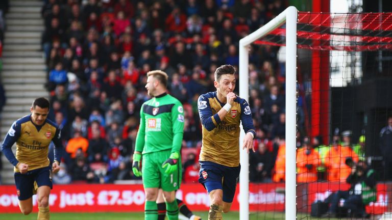 Mesut Ozil races away to celebrate Arsenal's opener