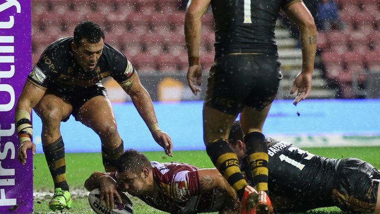 Wigan's Michael McIlorum scores his second try against the Dragons