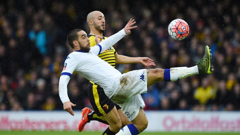 Giuseppe Bellusci of Leeds and Amrabat compete for the ball