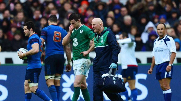 Ireland fly-half Johnny Sexton leaves the pitch due to injury