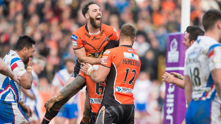 Roberts is mobbed by Luke Gale and Mike McMeeken after touching down