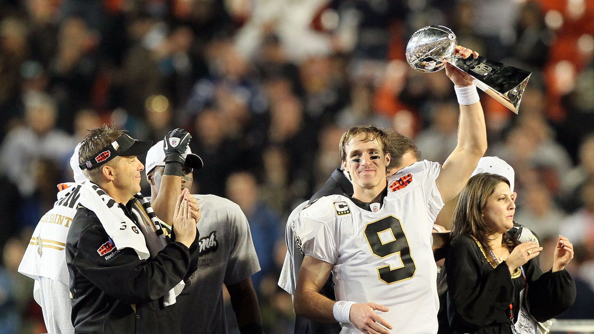 New Orleans Saints head coach Sean Payton watches as New Orleans Saints  quarter back Drew Brees holds aloft the Vince Lombardi Trophy after the  Saints defeated the Indianapolis Colts 31-17 in Super