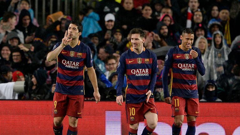 Luis Suarez celebrates with Lionel Messi and Neymar