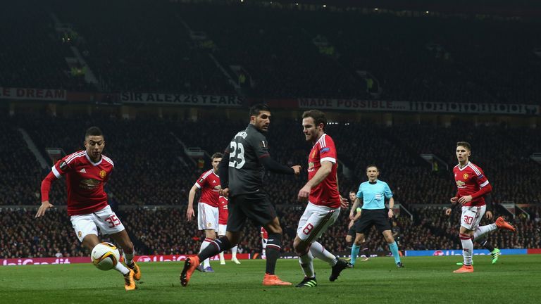 Juan Mata and Jesse Lingard of Manchester United in action with Emre Can