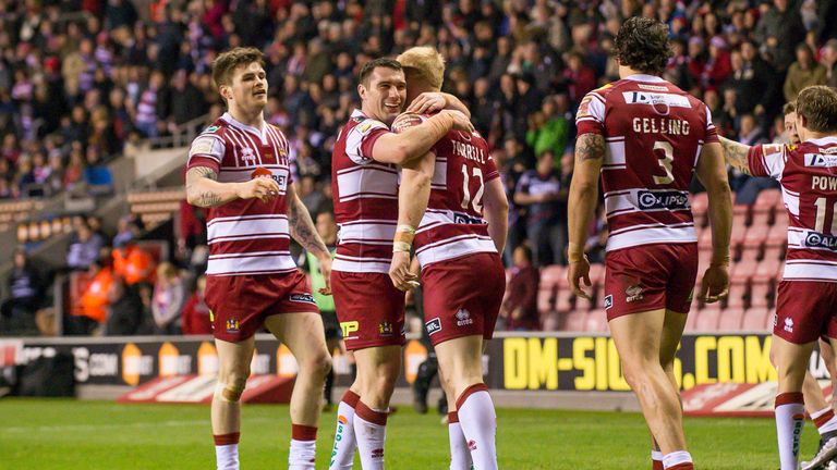 Matty Smith congratulates Liam Farrell after Farrell's try opened the scoring