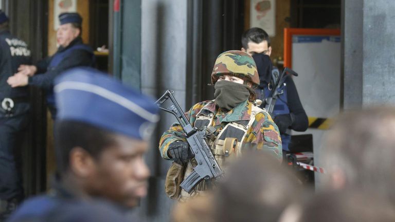 Police and soldiers stand guard following Tuesday's terrorist attacks