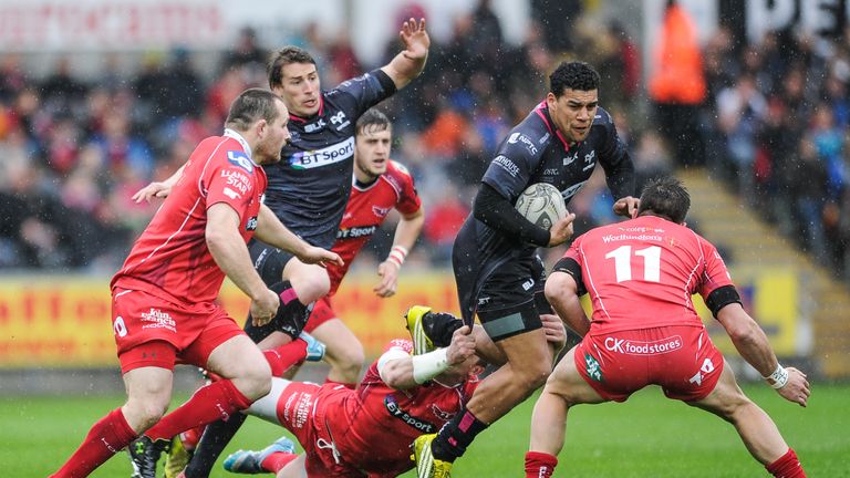 Ospreys try-scorer Josh Matavesi evades the tackle of Hadleigh Parkes