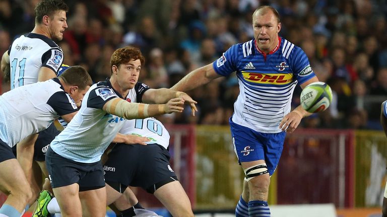 Andrew Kellaway passes the ball while Schalk Burger watches on