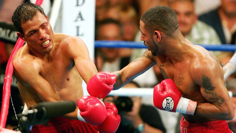 Diego Corrales lands a right on Jose Luis Castillo during their World Lightweight Unification bout