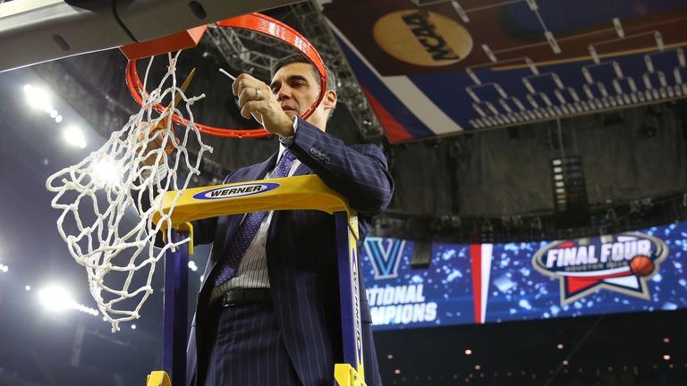 As per tradition, Villanova coach Jay Wright cuts down the net after his team's NCAA title victory