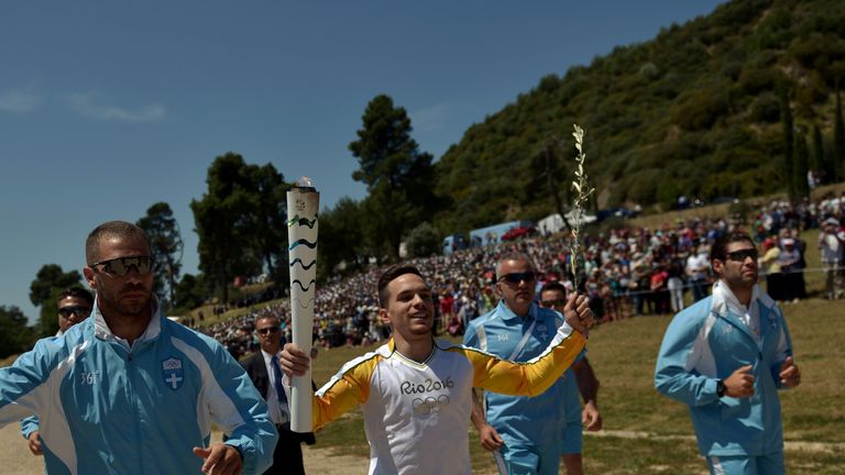 Lefteris Petrounias kicks off the torch relay at Olympia