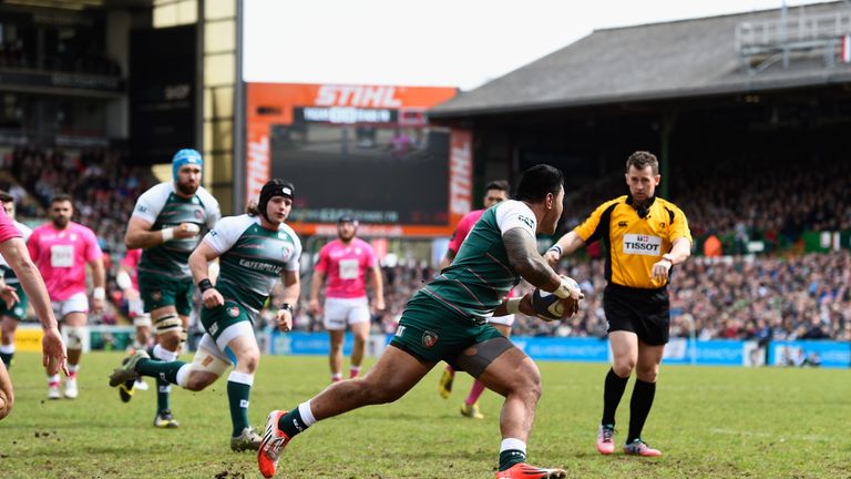 Tigers player Manu Tuilagi runs in the first try watched by referee Nigel Owens 