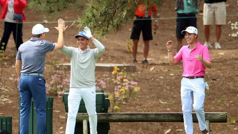 Rickie Fowler celebrates with Jordan Spieth after matching the ace of Justin Thomas at the fourth