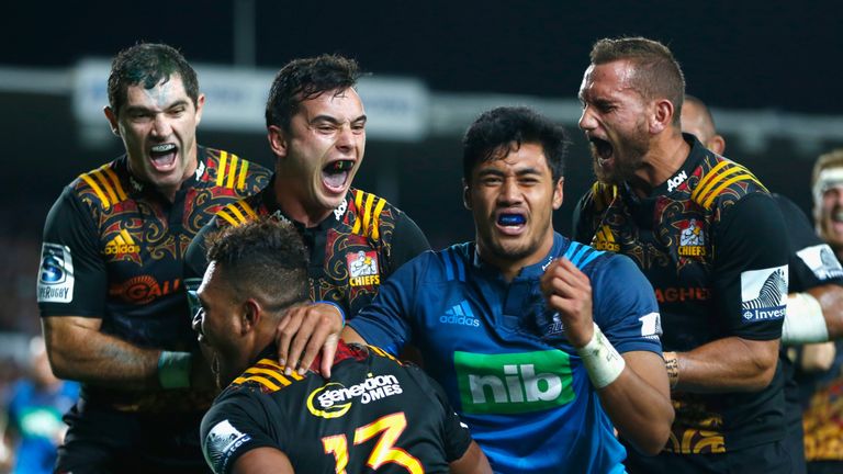 Stephen Donald, James Lowe and Aaron Cruden celebrate Seta Tamanivalu's (13) try against the Blues