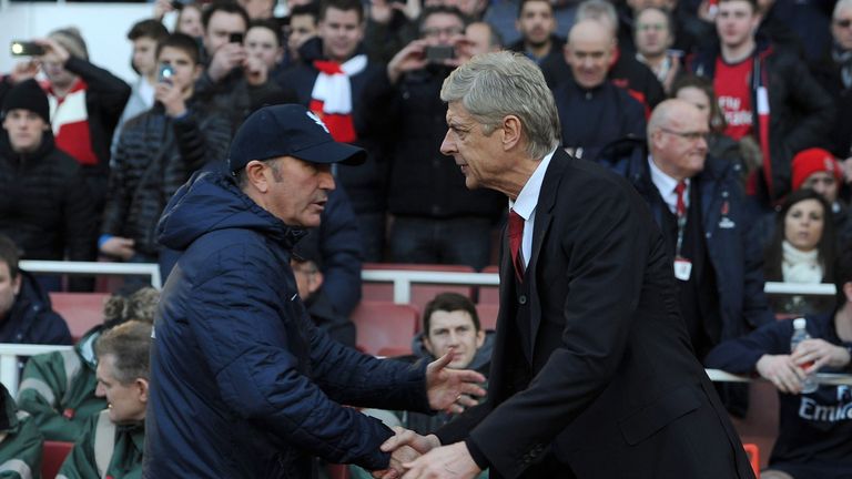 Tony Pulis (left) and Arsene Wenger clashed during Pulis' time as Stoke manager