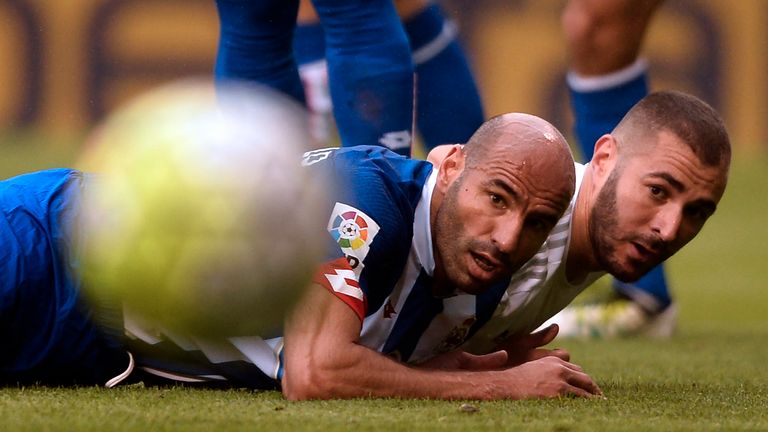 Pablo (left) and Karim Benzema watch the ball roll past