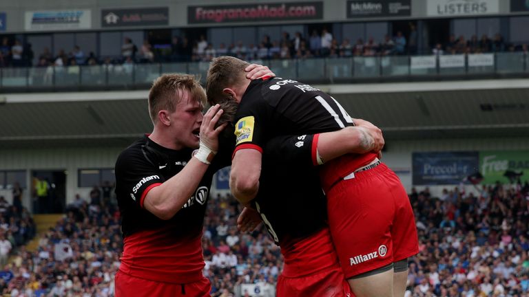 Chris Ashton is congratulated after scoring his second and Saracens' fourth try