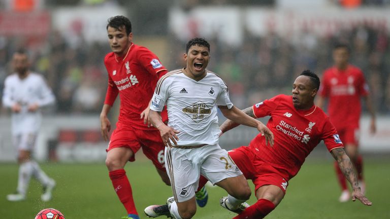 Jefferson Montero tumbles under Nathaniel Clyne's challenge