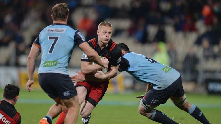 Johnny McNicholl of the Crusaders looks to break through the Waratah's defence