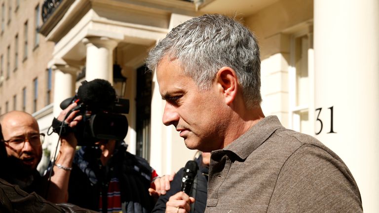 Mourinho speaks to the press as he leaves his house in London on Tuesday