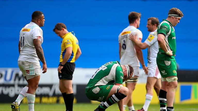 London Irish players dejected after their loss to Harlequins