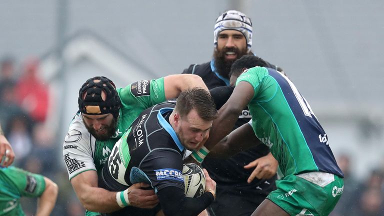 Stuart Hogg is tackled by Connacht duo John Muldoon and Nidi Adeolokun