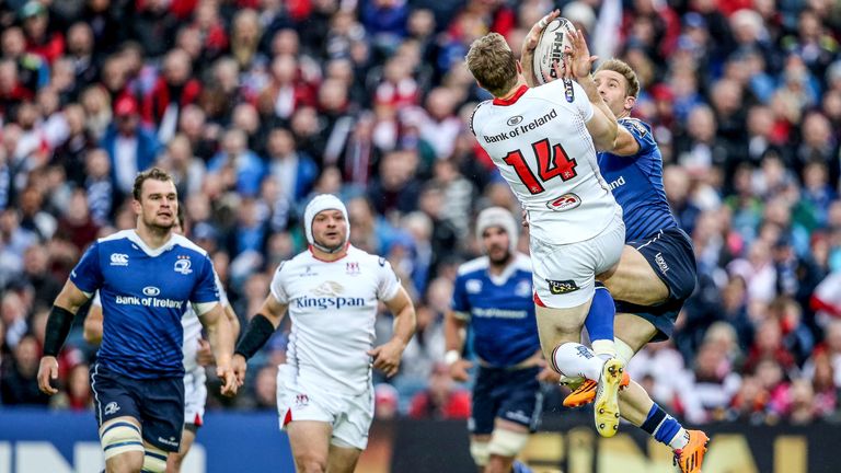 Luke Fitzgerald of Leinster vies for a high ball with Andrew Trimble of Ulster