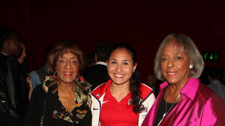 Sinha poses with Jesse Owens' daughters Marlene and Beverly at gala screening of Race