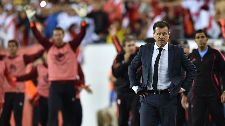 Brazil's coach Dunga (R) is pictured after being defeated by Peru