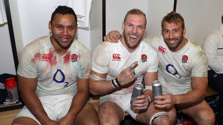 England's back row forwards, Billy Vunipola, James Haskell and Chris Robshaw celebrate after their victory during the Inte