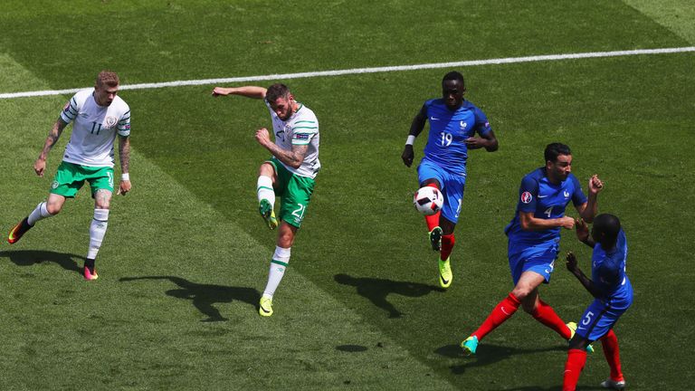 Daryl Murphy takes a shot at goal during the match in Lyon