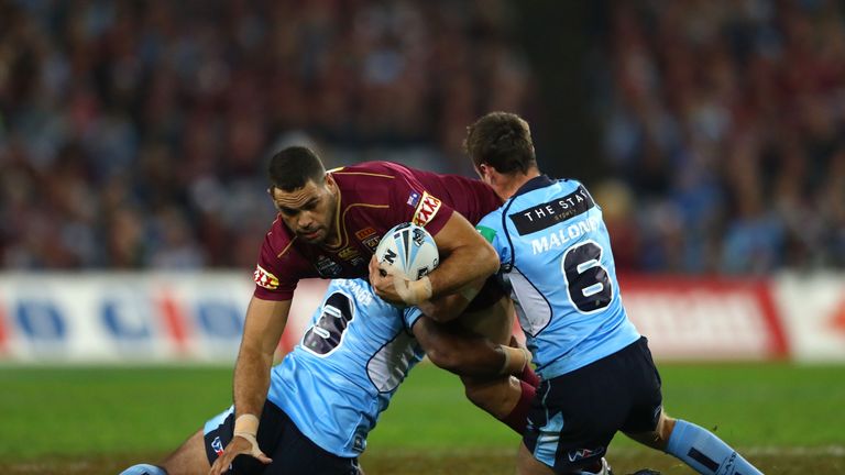 Queensland centre Greg Inglis is tackled