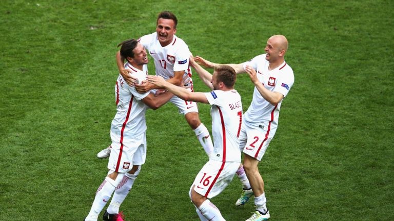 Grzegorz Krychowiak celebrates after scoring the winning penalty