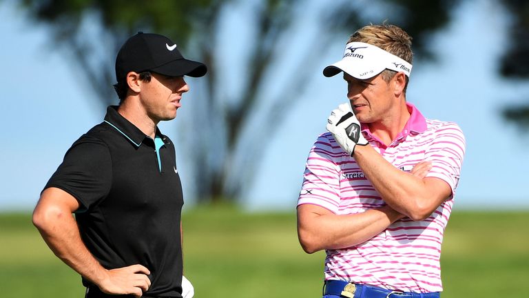 Rory McIlroy and Luke Donald compare notes during a practice round at Oakmont