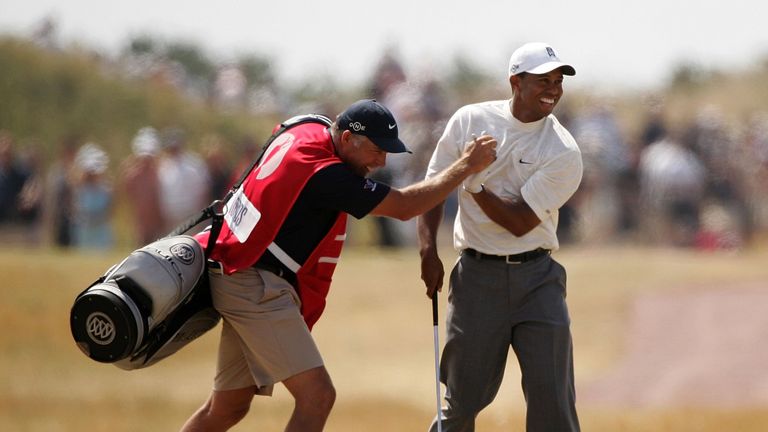 Tiger Woods celebrates holing a shot from the 14th fairway at Hoylake