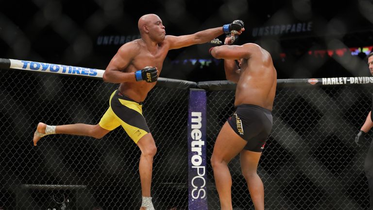 Daniel Cormier (right) avoids a punch by Anderson Silva